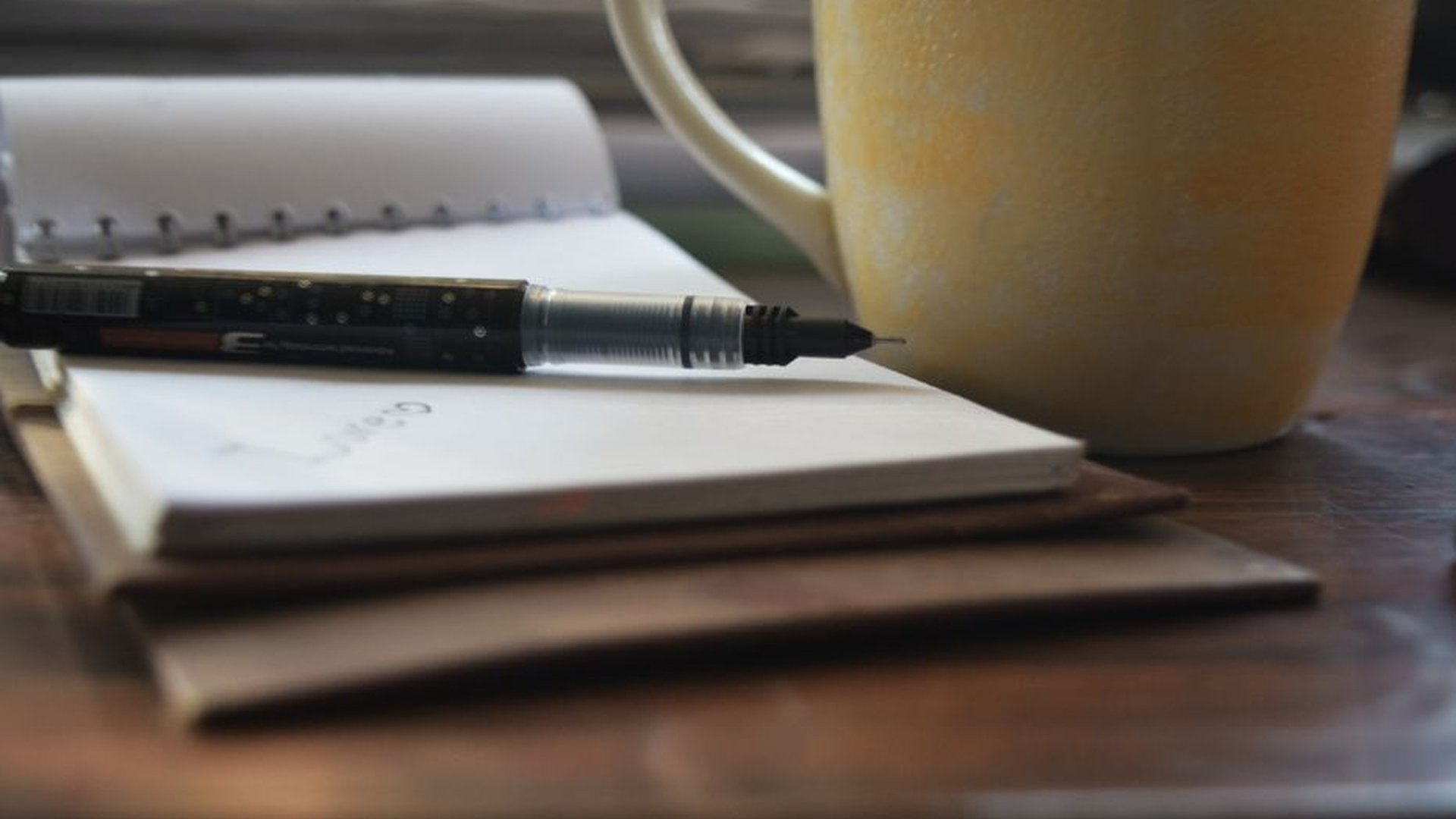 small notebook writing hand quiet temple morning l